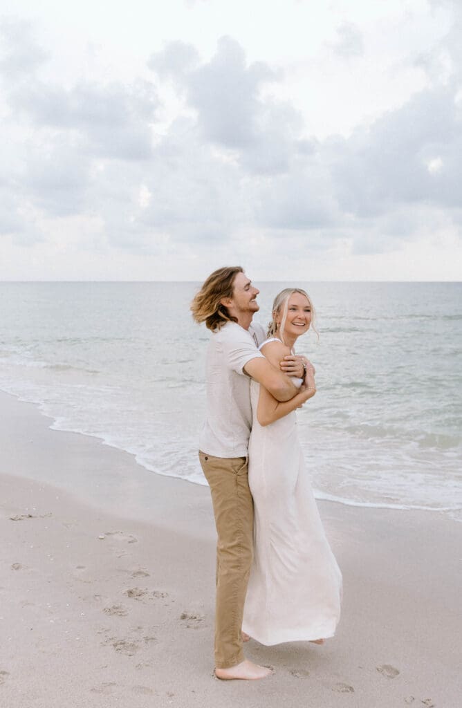 Candid moment of Richie and Meghan laughing together before their Naples Bay Resort wedding