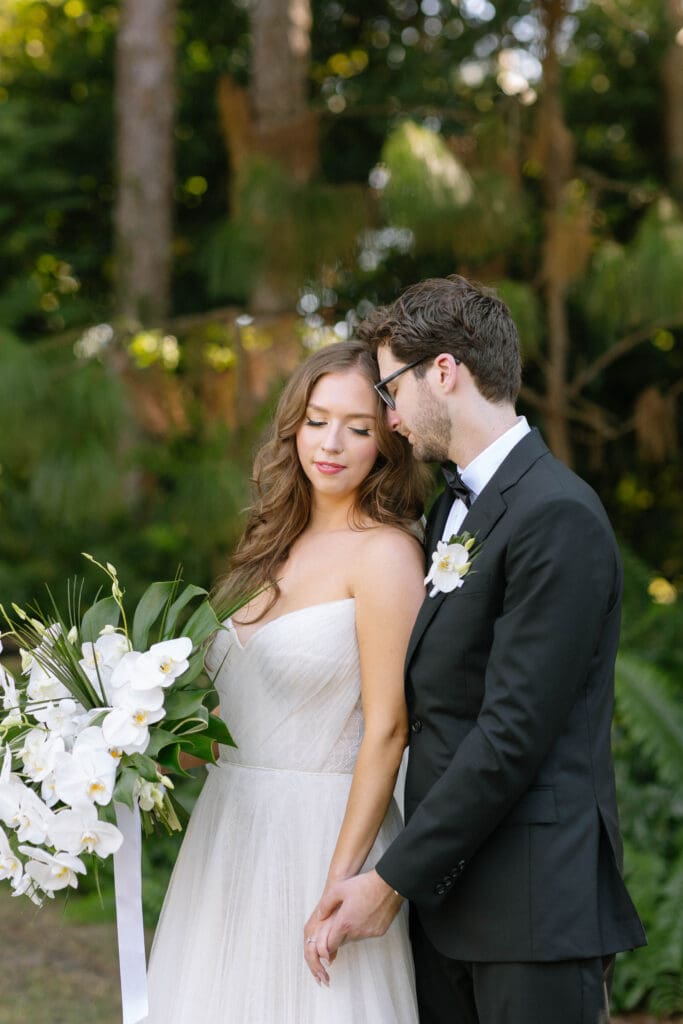 Bride and groom portraits surrounded by lush greenery at Naples Florida wedding