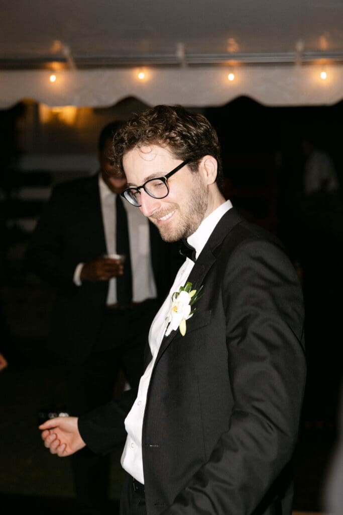 Bride and groom first dance under string lights at Naples Florida wedding