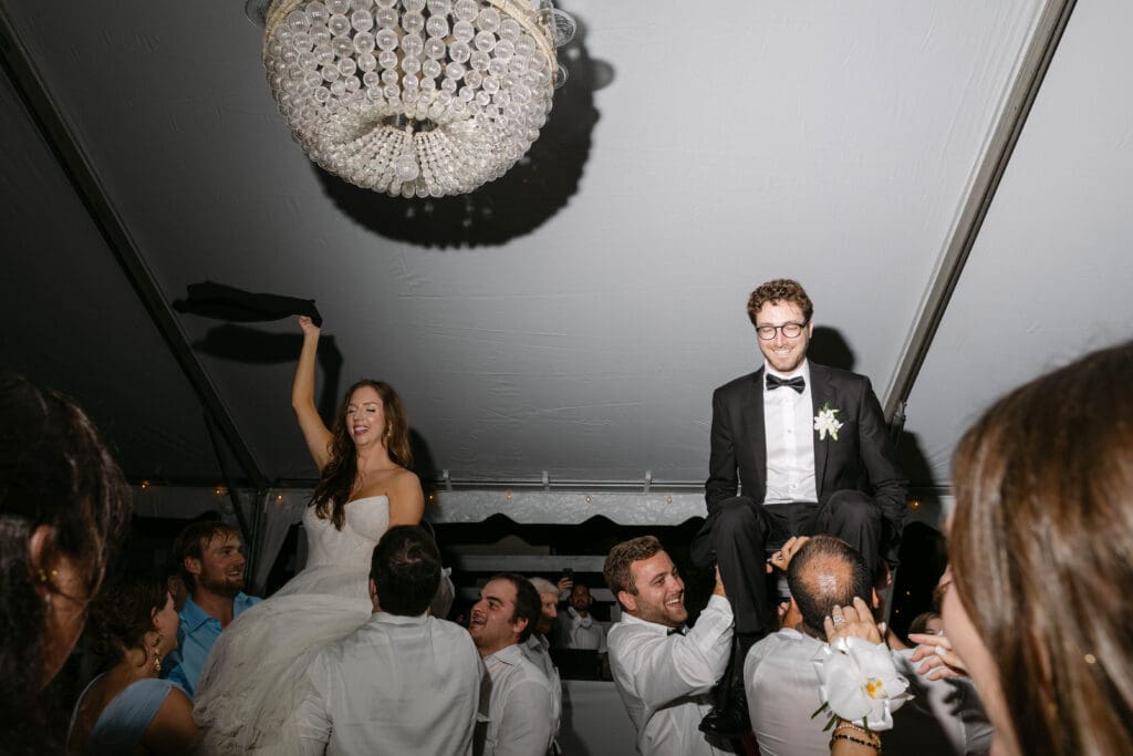 Guests celebrating colorful tropical wedding reception in Naples Florida