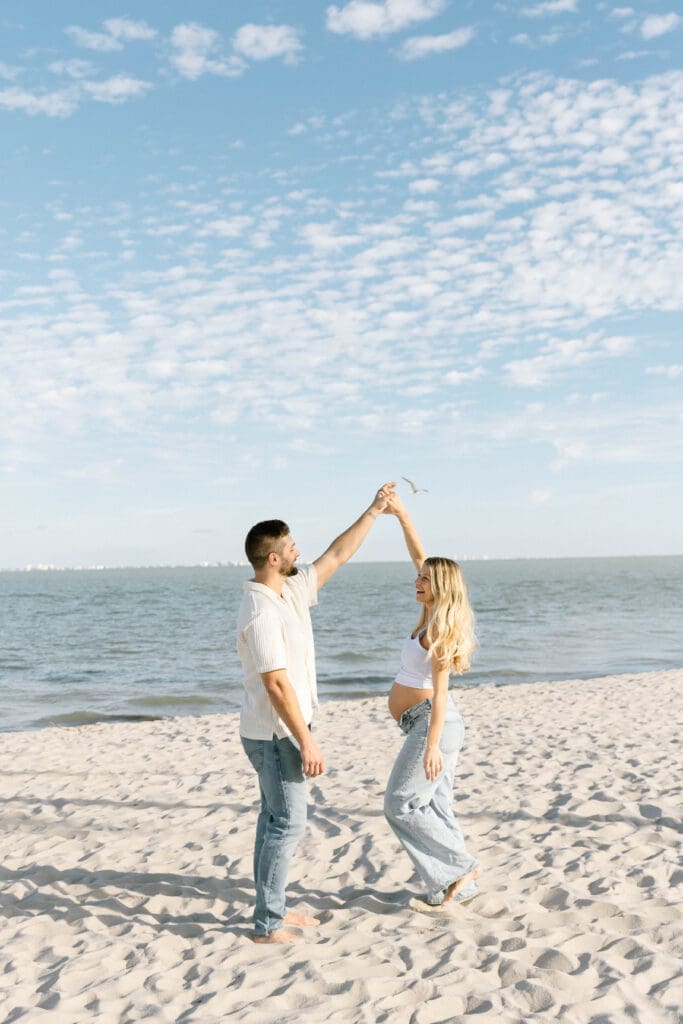 sanibel maternity photographer couple under palm trees