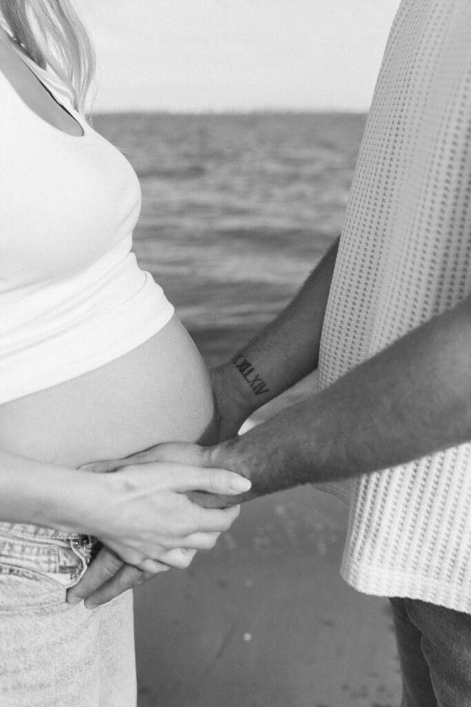 sanibel maternity photographer couple under palm trees