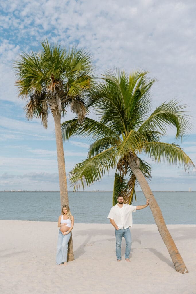 coastal maternity photos white outfit denim beach florida