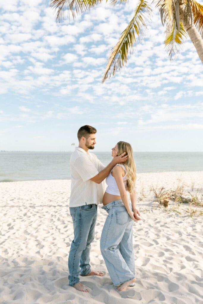 maternity session sanibel island couple laughing candid moment